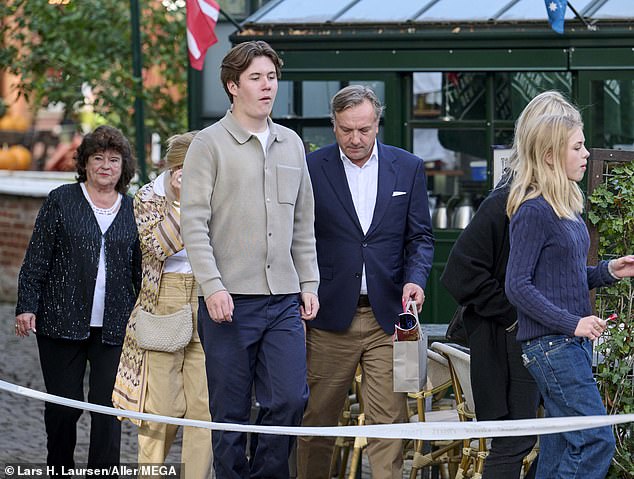 Prince Christian looked smart in navy chinos which he teamed with a gray wool top