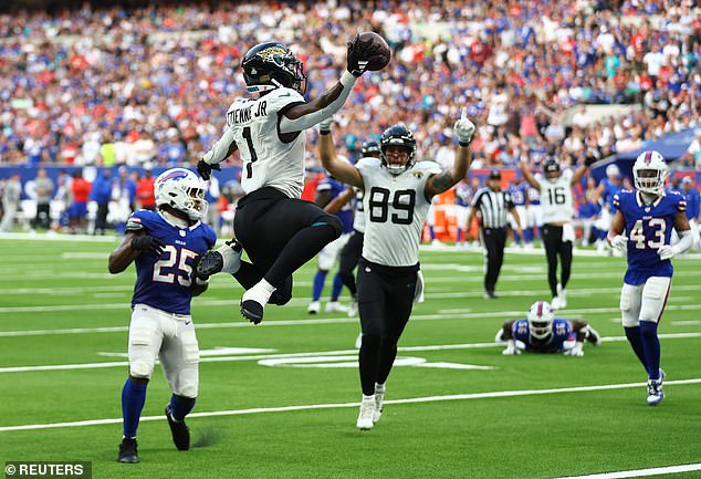 Jacksonville Jaguars running back Travis Etienne scores one of his two touchdowns that day.