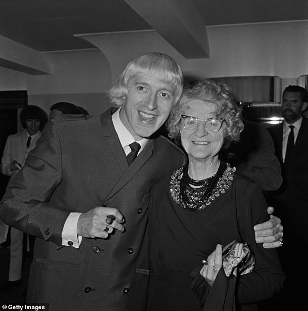 Complicated: Savile with his mother Agnes at lunch at the Variety Club, London, September 1965.