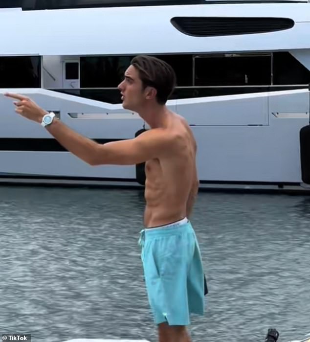 However, the shirtless man continues to frantically yell at the other yacht owner as he stands on the dock.