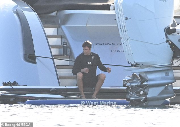 Brady is seen boarding a plane from Indian Creek Island where he is building his new home