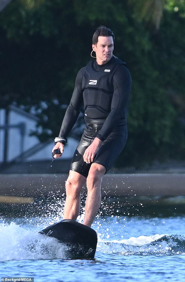 Brady wears a black wetsuit while flying around Biscayne Bay last week