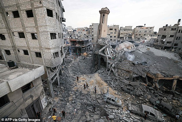 Provocation of Israel also enables Hamas and Iran to drum up sympathy for the Palestinian cause throughout the Middle East.  In the photo, people stand among the ruins of a destroyed mosque