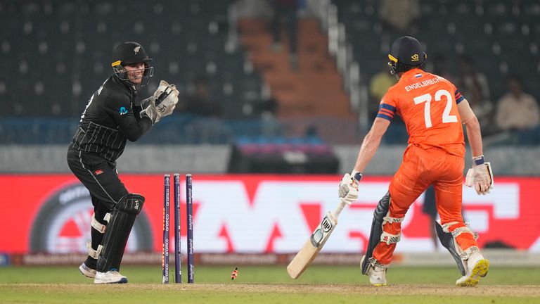 New Zealand wicketkeeper Tom Latham clears the bails to dismiss Sybrand Engelbrecht of the Netherlands, who was not deemed out by the third umpire.