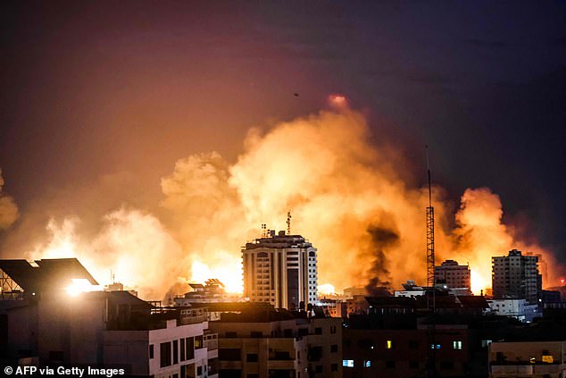 A fireball erupts during Israeli bombardment of Gaza City on October 9, 2023. Israel imposed a total siege on the Gaza Strip on October 9, cutting off the water supply as it bombed targets