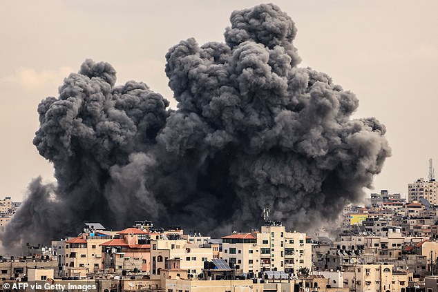 A plume of smoke rises into the sky over Gaza City during an Israeli airstrike on October 9, 2023. Israel pounded the Gaza Strip mercilessly overnight and on October 9 as fighting with Hamas continued around the Gaza Strip