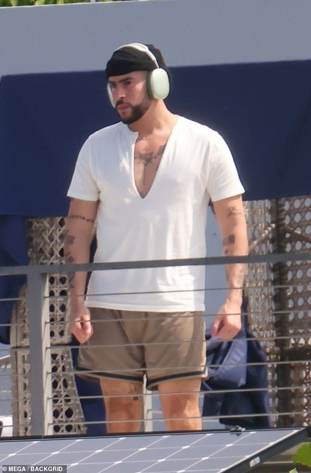 Relaxed: The 27-year-old supermodel and 29-year-old music artist matched in his and hers white T-shirts as they hung out on a rooftop