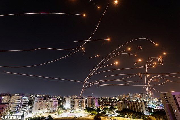 Israel's Iron Dome anti-missile system intercepts rockets fired from the Gaza Strip, as seen from the city of Ashkelon, Israel, October 8, 2023