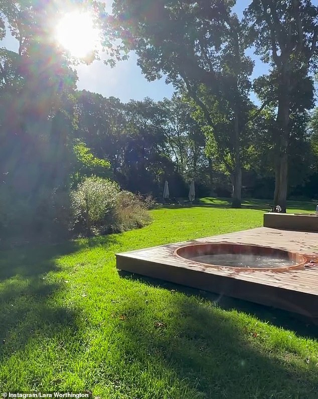 One photo shows a lavish wooden spa on the ground floor that sits on an outdoor deck