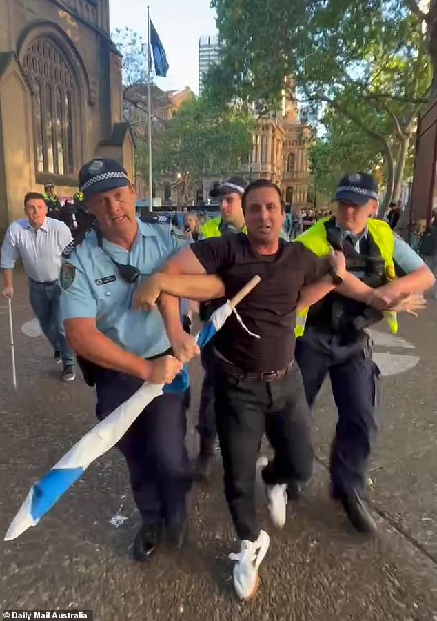 Meanwhile, Sydney businessman Mark Spiro (pictured) was arrested by police after holding an unfurled Israeli flag while repeatedly saying 