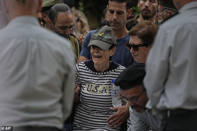 The mother of Israeli col.  Roi Levy cries during her son's funeral at Mount Herzl Cemetery in Jerusalem on Monday, October 9, 2023. Col.  Roi Levy was killed after Hamas militants from the blockaded Gaza Strip stormed into nearby Israeli towns