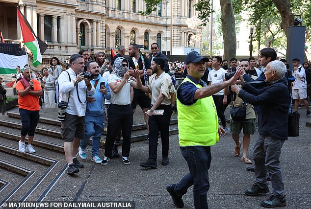 A man in a high shirt shouted at Mr Leach to 'get out of here'