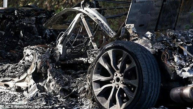 The attackers fled the scene in a luxury SUV and police are investigating whether a black Range Rover Sport (pictured), which was later found burnt out, is linked to the attack.