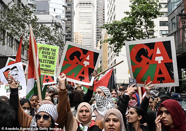 Pro-Palestinian protesters are seen outside the consulate of Israel on Monday