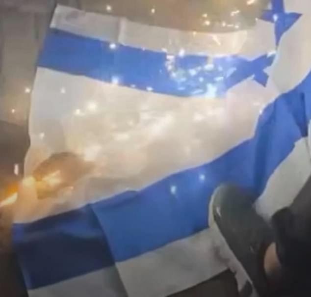 Pro-Palestine protesters stamped on the Israeli flag, and appeared to have set it on fire