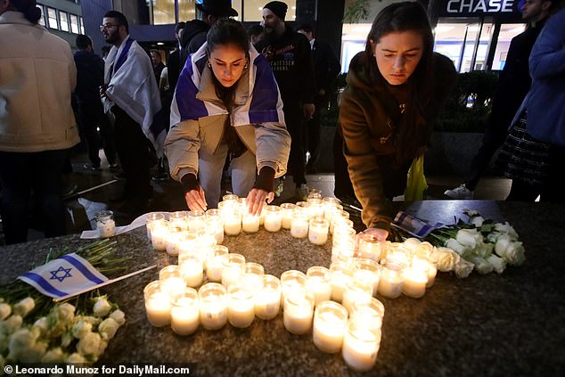 Pro-Israel protesters light candles in Manhattan on Monday