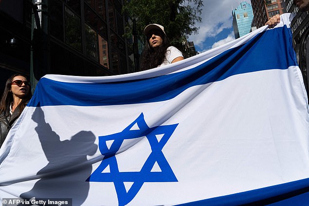 On the pro-Israel side of the demonstration, demonstrators waved the national flag