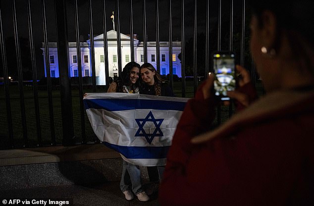 The White House is lit in blue and white to underscore American solidarity with Israel