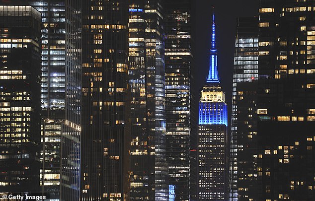 The Empire State Building illuminated in the colors of the flag of Israel as seen from New Jersey