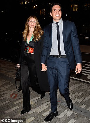 Dressed to impress: Will sweetly held hands with girlfriend Amanda Dubin and looked dapper in a smart navy blue suit which consisted of trousers and a matching blazer which remained unbuttoned