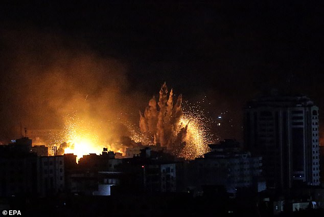 Israeli airstrikes on Gaza City (pictured) continued Monday night after more than 900 Israelis were killed and more than 2,000 injured in an attack by Hamas