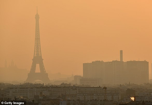 The Paris Agreement, first signed in 2015, is an international agreement to control and limit climate change.  In the photo: air pollution above Paris in 2019.