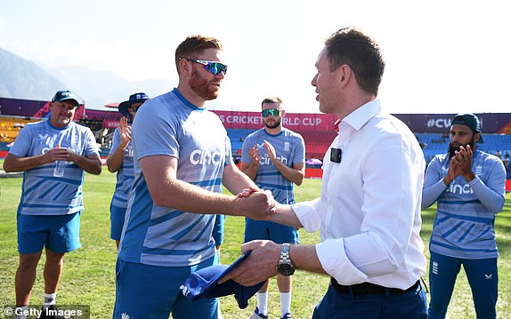 DHARAMSALA, INDIA - OCTOBER 10: Jonny Bairstow of England is presented with his 100th cap by former England captain Eoin Morgan ahead of the ICC Men's Cricket World Cup India 2023 between England and Bangladesh at HPCA Stadium on October 10 2023 in Dharamsala, India.  (Photo by Gareth Copley/Getty Images)