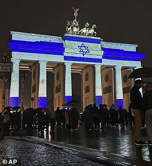 The Brandenburg Gate is lit up in the colors of the Israeli flag in Berlin, Germany this weekend as a show of solidarity.