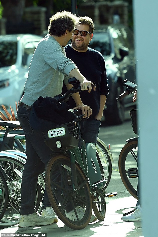 Great times: James had a big smile on his face when he caught up with a cyclist friend