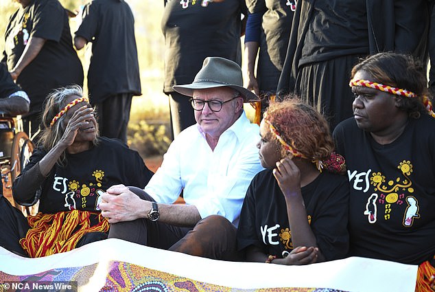 The Prime Minister was seen puffing as traditional landowners danced and chanted while holding his hands