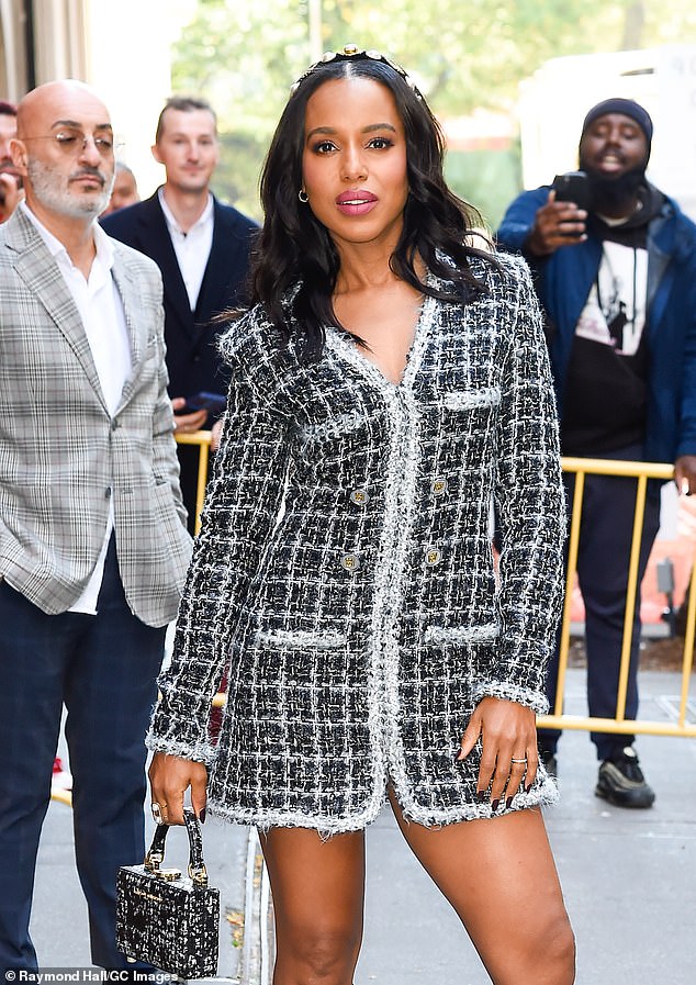 The thigh is the limit!  Carey completed her elegant look with a black bejeweled headband and a $350 Brandon Blackwood 'Slim Trunk' handbag in tweed snakeskin