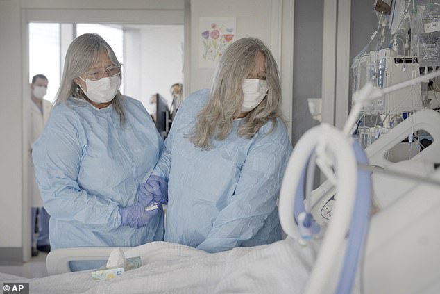 In a tearful farewell at her brother's bedside, Mary Miller Duffy (right) said: 