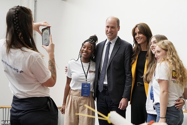 Say cheese!  The Prince and Princess of Wales pose for a photograph while in Birmingham