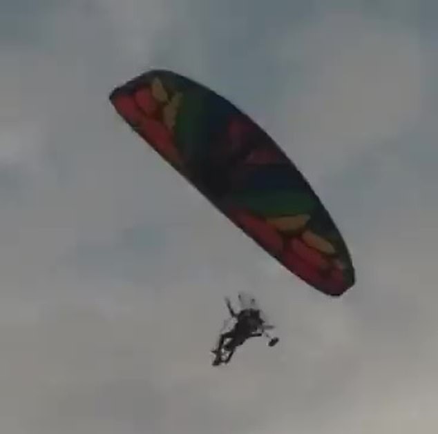 Hamas fighters bypassed Israel's border with the Gaza Strip by paraglider, according to the Israeli military (pictured: a paraglider allegedly crossing into Israel)