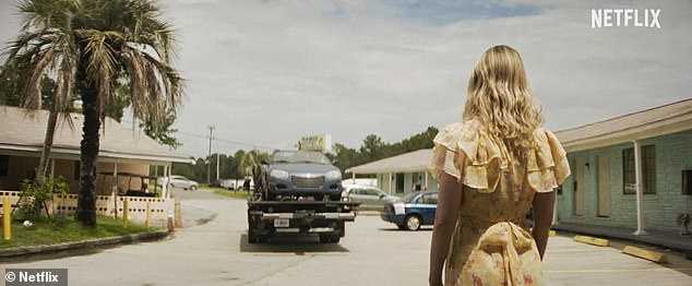 Sinking Feeling: Lisa watches her car being towed away