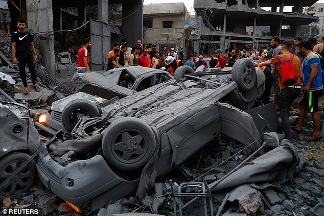 Palestinians inspect damages in the wake of Israeli strikes, following a Hamas surprise attack, at Beach refugee camp, in Gaza City, October 9, 2023