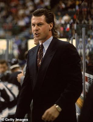 Barry Melrose of the Los Angeles Kings behind the bench during a game, October 1992