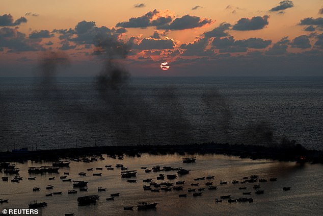 Smoke rises after Israeli strikes on Gaza City's seaport, Gaza, October 10, 2023