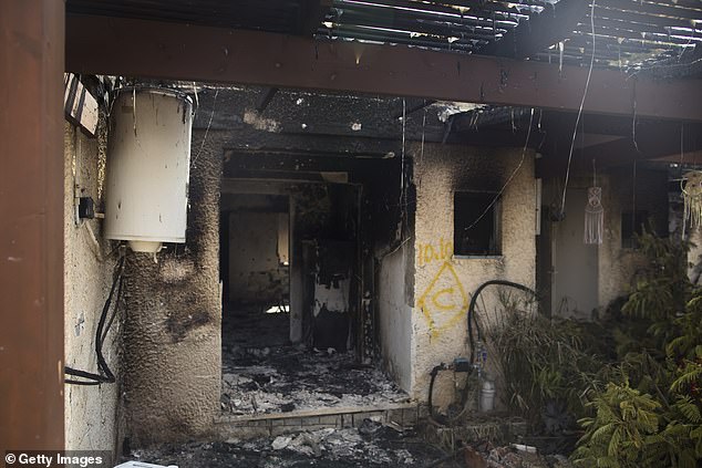 A burnt house after an attack by Palestinian militants on a kibbutz near the border with Gaza on October 10, 2023 in Kfar Gaza, Israel