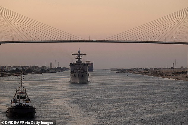 Amphibious dock landing ship USS Carter Hall is seen in August moving through the Suez Canal - a vital route connecting Europe and Asia