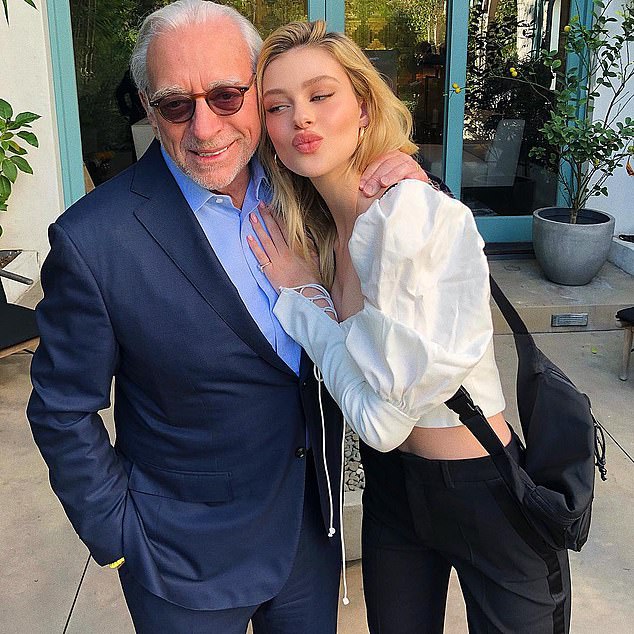 The billionaire Nelson Peltz (left) with his daughter Nicola (right).  The activist investor now owns $2.5 billion worth of Disney stock