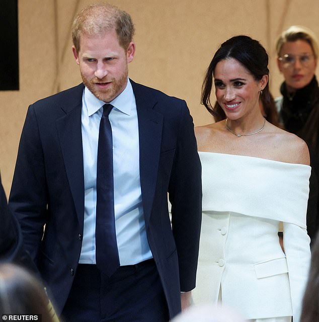 Meghan, 42, was seen wearing a glamorous white strapless trouser suit as she arrived at the Hudson Yards venue for the summit, where the couple discussed the dangers of social media