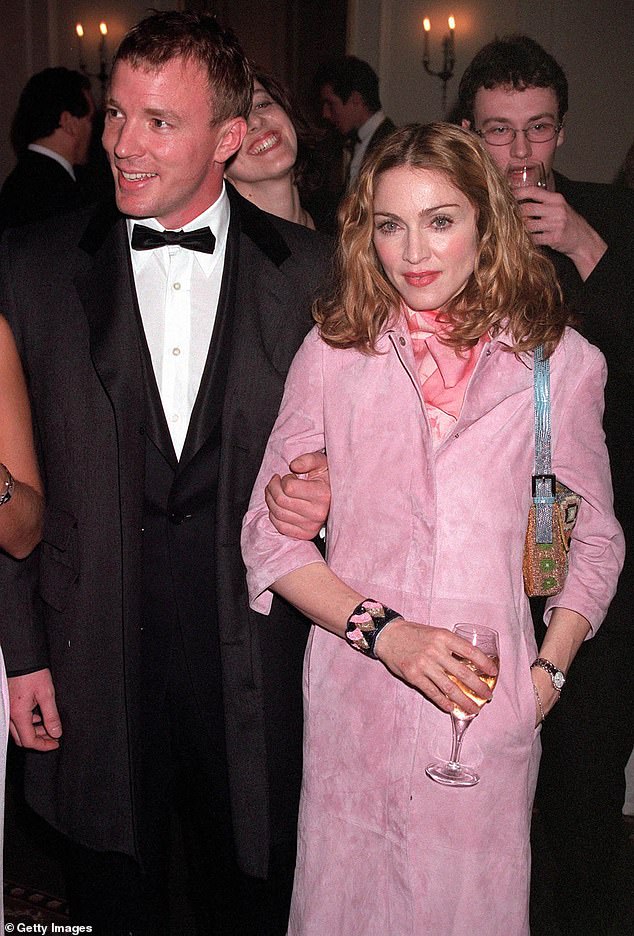 Dashing: In an apparent attempt to reassure her that her fans don't call her commoner, Guy is said to have told her that Madge is short for Her Majesty;  the couple is pictured in 2000