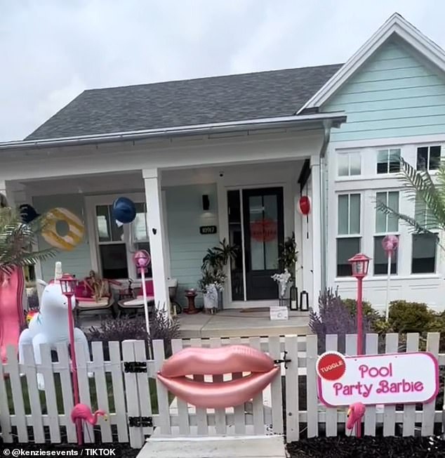 The Pool Party Barbie house has a festive inflatable lips on the main fence along with plastic flamingos