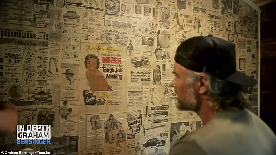 Vintage decor: Inside his home, he showed off a wallpaper of vintage newspaper ads from the 50s that he found in the cabin and used as decoration