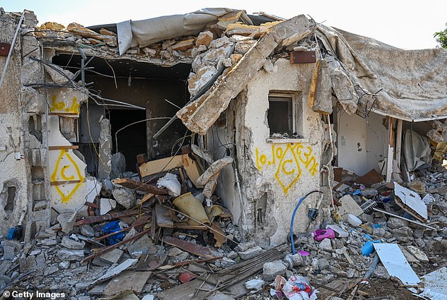 A view of a house left in ruins after an attack by Hamas militants on this kibbutz days earlier when dozens of civilians were killed near the border with Gaza on Tuesday.