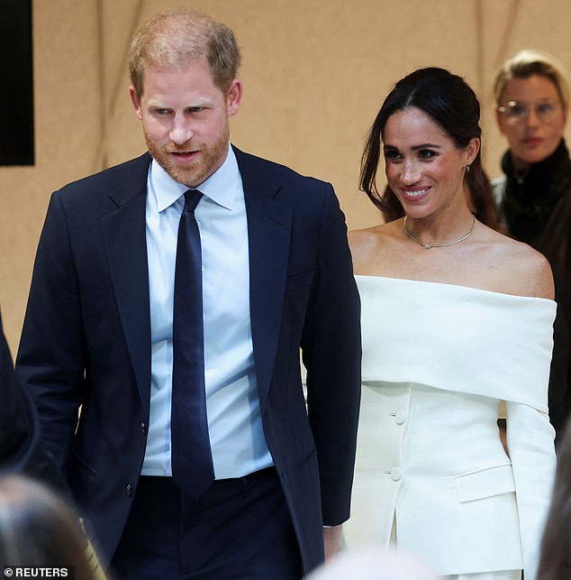 Meghan, 42, was spotted in a glamorous strapless white trouser suit as she arrived at the Hudson Yards venue for the summit, where the couple will discuss the dangers of social media.