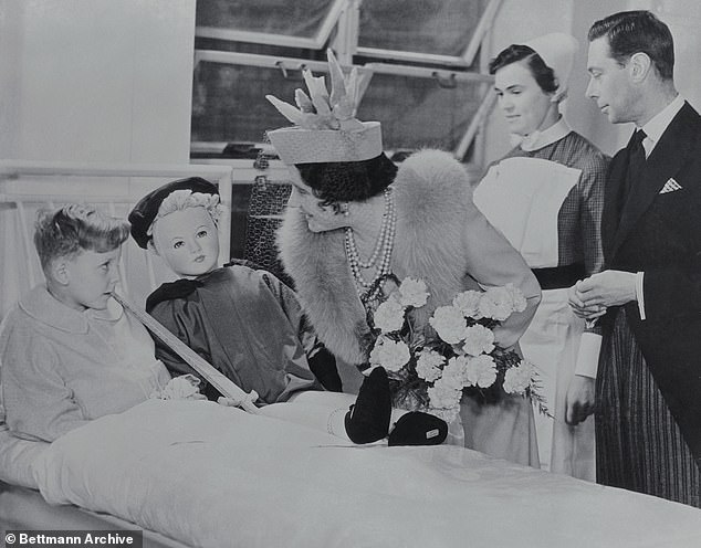 King George VI and the Queen Mother are seen on a tour of Great Ormond Street Hospital in October 1938 when they opened the institution's Southwood Building.