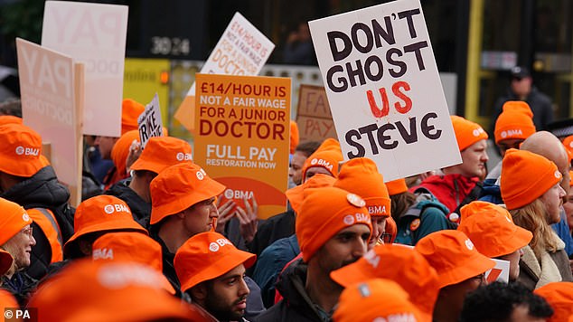 Doctors and medical staff from the British Medical Association (BMA) protest outside Mancheser Library during the Conservative Party's annual conference last week