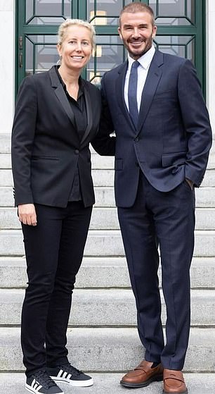 Beckham poses for photos with Anita Elberse, the professor of Business Administration